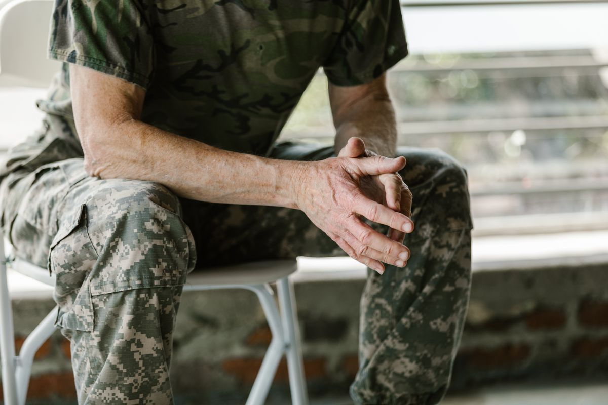Jobs for veterans with PTSD: close-up of a veteran’s hands during a therapy session